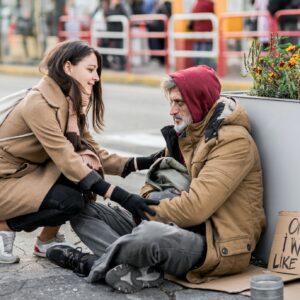 Young woman giving money to homeless beggar man sitting in city.