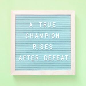 A true champion rises after defeat. Quote.